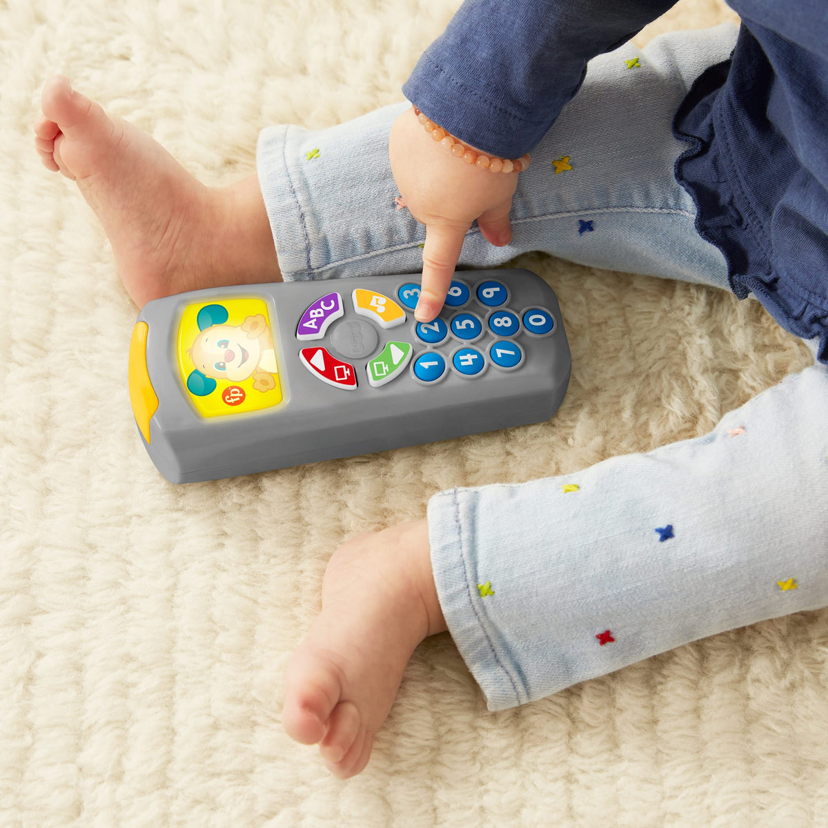 Türkçe dil desteğiyle bebekler ve yürüme çağındaki çocuklar için ışıklar ve şarkılar içeren, eğitici Fisher-Price® Eğlen ve Öğren® Köpekçiğin Uzaktan Kumandası