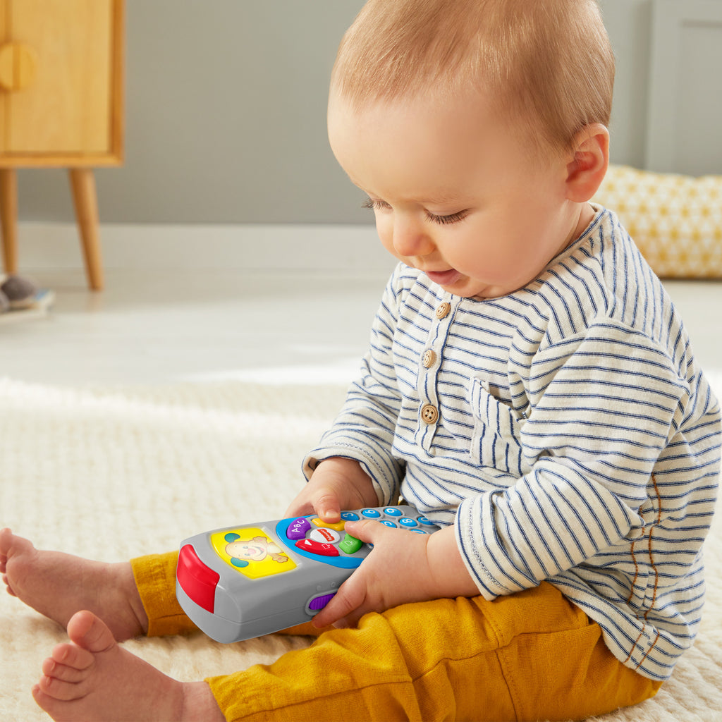 Türkçe dil desteğiyle bebekler ve yürüme çağındaki çocuklar için ışıklar ve şarkılar içeren, eğitici Fisher-Price® Eğlen ve Öğren® Köpekçiğin Uzaktan Kumandası