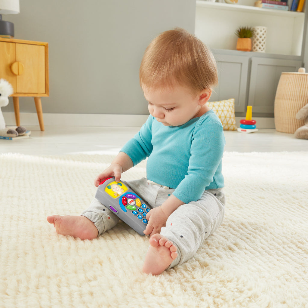Türkçe dil desteğiyle bebekler ve yürüme çağındaki çocuklar için ışıklar ve şarkılar içeren, eğitici Fisher-Price® Eğlen ve Öğren® Köpekçiğin Uzaktan Kumandası