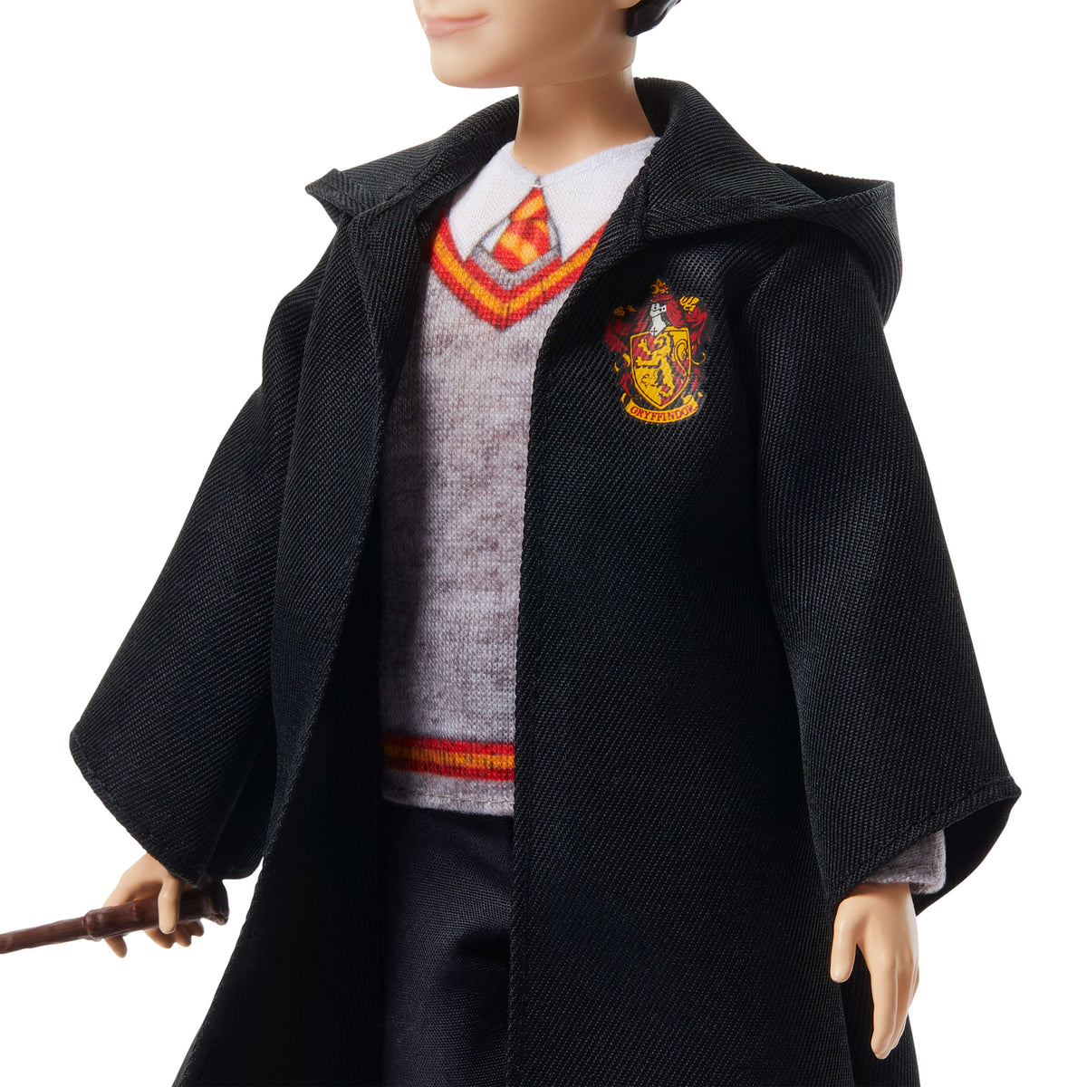 Karakteristik Hogwarts üniforması ve asasıyla birlikte filmden ilham alan Harry Potter bebeği