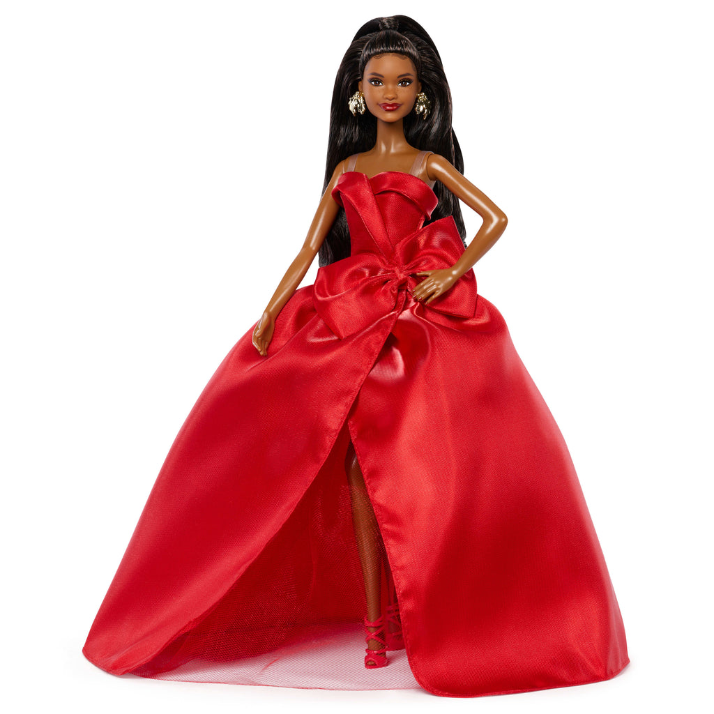 Barbie Signature 2026 Mutlu Yıllar Barbie bebeği, sezona özel koleksiyon ürünü, fiyonk detaylı kırmızı elbise giyen siyah saçlı bebek