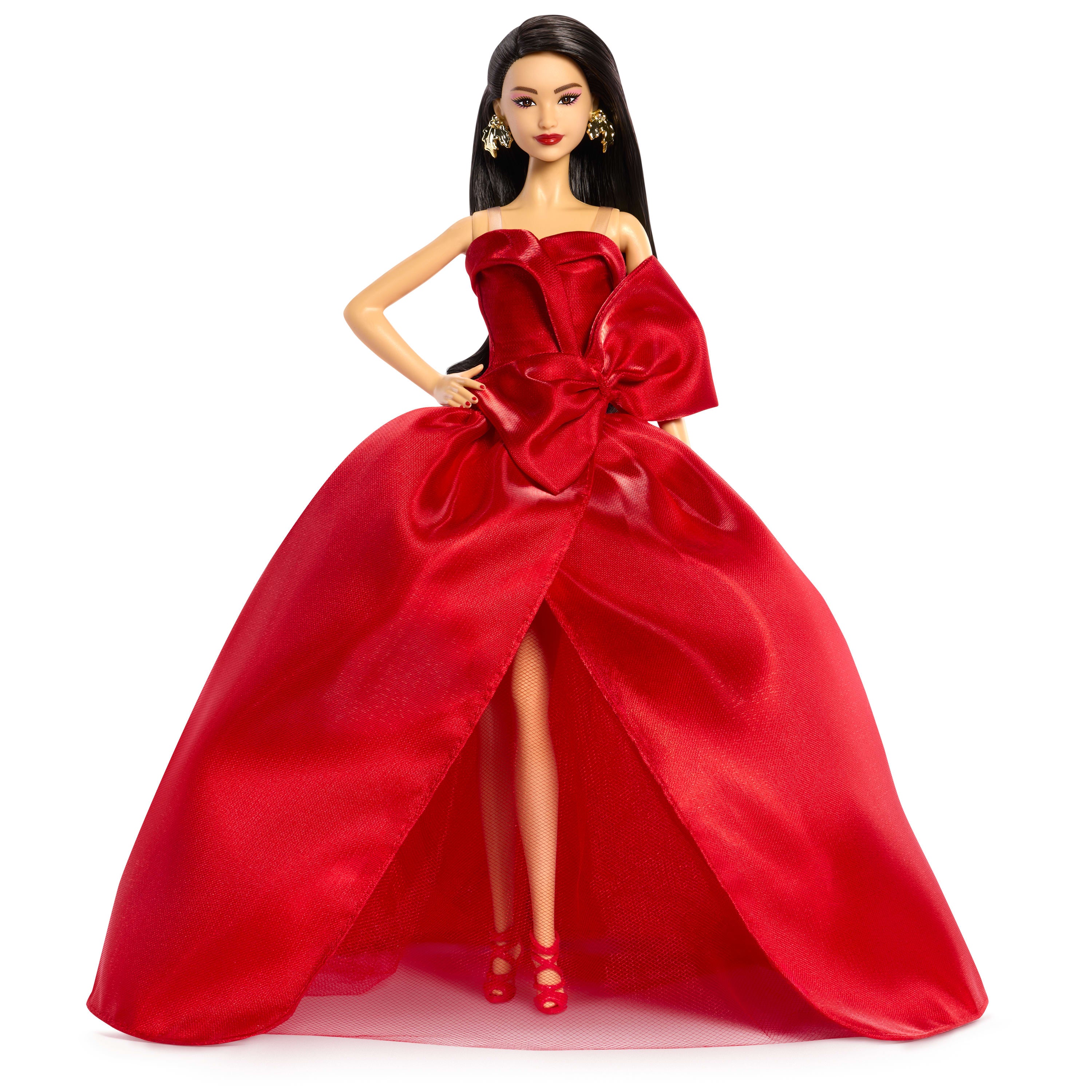 Barbie Signature 2026 Mutlu Yıllar Barbie bebeği, sezona özel koleksiyon ürünü, fiyonk detaylı kırmızı elbise giyen koyu kahverengi saçlı bebek