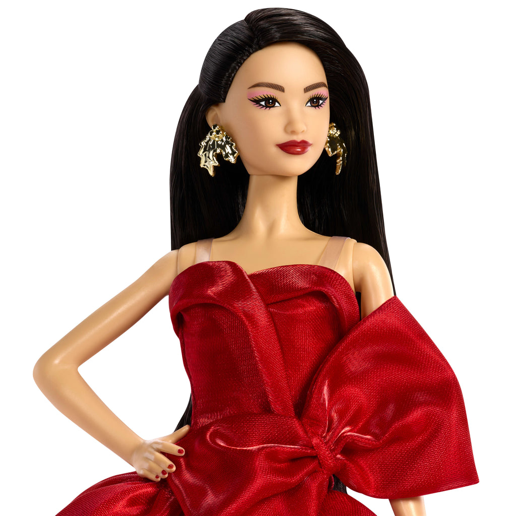 Barbie Signature 2026 Mutlu Yıllar Barbie bebeği, sezona özel koleksiyon ürünü, fiyonk detaylı kırmızı elbise giyen koyu kahverengi saçlı bebek