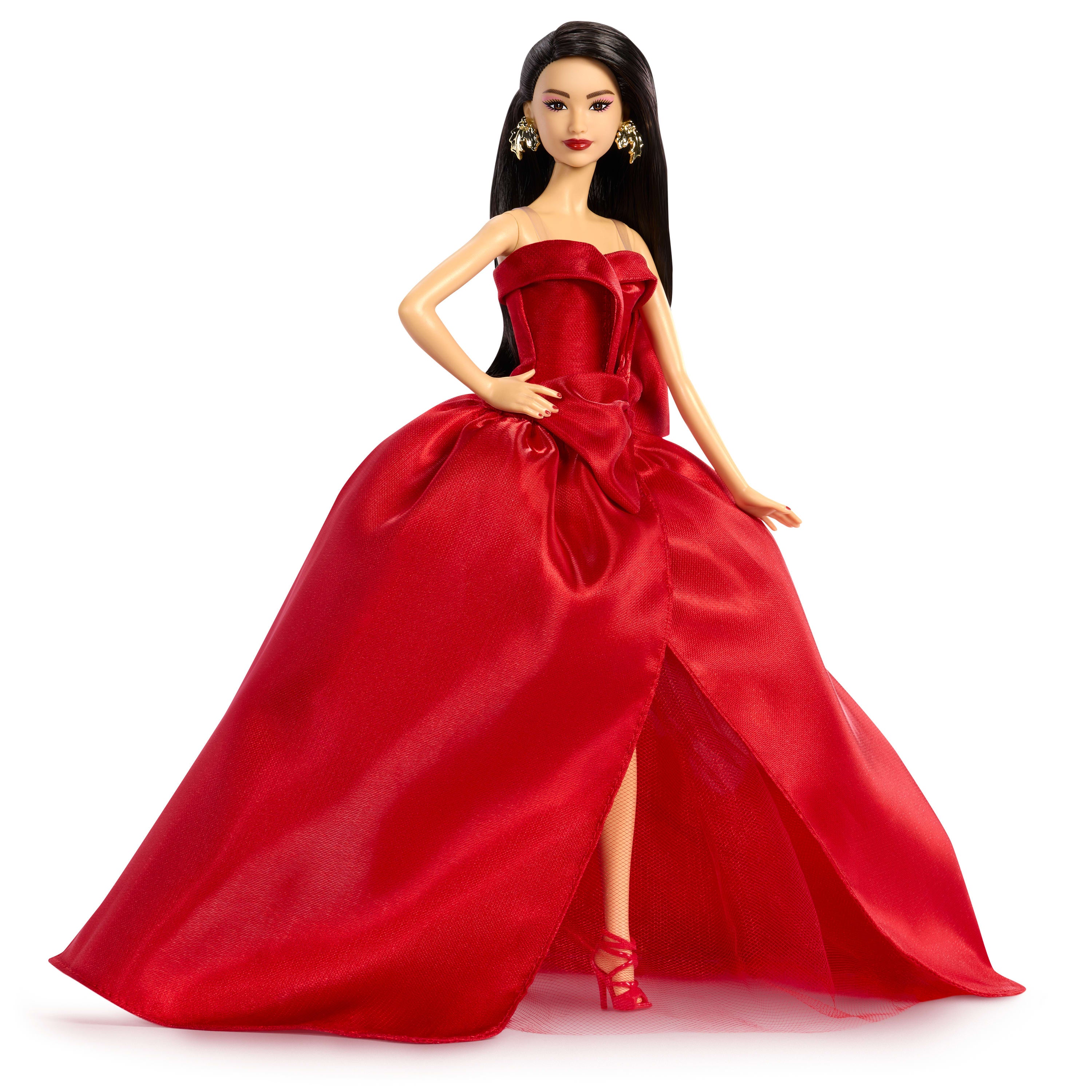 Barbie Signature 2026 Mutlu Yıllar Barbie bebeği, sezona özel koleksiyon ürünü, fiyonk detaylı kırmızı elbise giyen koyu kahverengi saçlı bebek